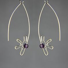 This unique flower hoop earrings are handmade using 999 sterling silver and amethyst. The last two pictures are the matching bracelet. The Length of the earrings is 2 inches / 50 mm. ;-) My contact number: 626-379-1904. Please contact me if you would like to order multiples or customize a design for your special event, I will be pleased to give you a discount on a quantity order. ;-) Purchases will be shipped within 1-3 business days. In case of occasional shortage of beads material, purchases w