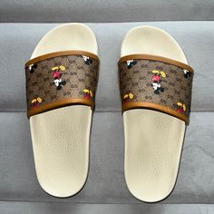 *Size: 7 *Brown Gucci Print With Mickey Mouse’s *Very Lightweight And Comfortable *Sold Out Collection! Designer Brown Flat Slides, Gucci Brown Slip-on Sandals, Luxury Brown Slides With Round Toe, Gucci Print, Shoes Gucci, Gucci Shoes, Disney Mickey Mouse, Disney Mickey, Women's Shoes Sandals