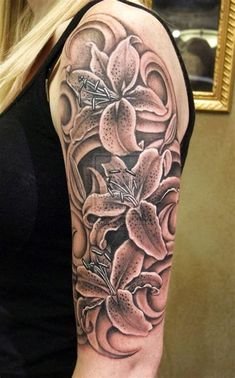 a woman's arm with flowers on it