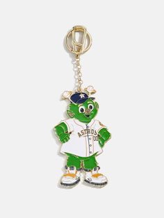 a keychain with a baseball player in the shape of a frog wearing a hat