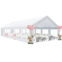 a large white tent with tables and chairs