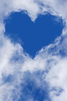 a blue heart shaped cloud in the sky