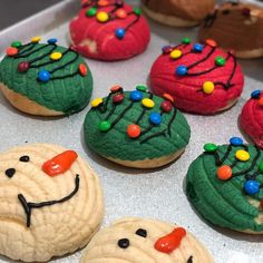 decorated cookies in the shape of christmas trees and snowmen