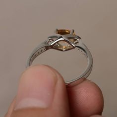 This is a gorgeous handmade creation. Its beauty is its simplicity & Elegance. The 5*7 mm oval shape faceted natural citrine is crafted in solid sterling silver and with rhodium plated. All item is sent in a beautiful gift box If you have any idea of design your ring,pls contact me directly. You can realize more lovely stuff clicking the link https://www.etsy.com/shop/knightjewelry?refshopsection_shophome_leftnav Please leave the correct address and you phone number for delivering successful Elegant Silver Citrine Birthstone Ring, Oval Citrine Topaz Ring In White Gold, Oval Citrine Birthstone Ring For Anniversary, Oval Citrine Crystal Ring With Birthstone, Oval Citrine Birthstone Crystal Ring, Oval Citrine Solitaire Jewelry, Oval Solitaire Citrine Jewelry, Oval Amber Topaz Ring, Oval Citrine Silver Ring