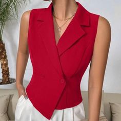 Elevate Your Wardrobe With The Striking Red Double-Breasted Sleeveless Blazer, A Perfect Blend Of Sophistication And Modern Elegance. This Vest-Style Blazer Showcases A Stunning Asymmetrical Hem And A Classic Lapel Neckline, Making It A Standout Piece For Any Occasion. The Double-Button Closure Adds A Touch Of Refined Detail, While The Vibrant Red Color Ensures You Make A Bold Statement. Crafted From High-Quality Woven Fabric, This Blazer Features A Regular Fit That Exudes Confidence And Style. Fitted Sleeveless Office Vest, Fitted Red Vest For Summer, Red Fitted Vest For Summer, Elegant Fitted Red Vest, Red V-neck Vest For Spring, Red Fitted Sleeveless Vest, Formal Sleeveless Solid Color Tops, Formal Sleeveless Solid Tops, Formal Solid Sleeveless Top