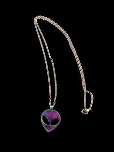 Add some excitement to your jewelry collection with this unique and colorful rainbow Alien head pendant and chain. The chain is 18 inches total length and is colored like the pendant. This necklace will be a beautiful statement piece. Makes a great gift. Necklace comes on a card and in a cellophane bag, ready to give as a gift. Multicolor Metal Chain Necklace As A Gift, Multicolor Metal Chain Necklace For Gifts, Multicolor Metal Pendant Charm Necklaces, Rainbow Necklace With Adjustable Chain For Gift, Purple Metal Chain Necklace Gift, Purple Metal Chain Necklace As Gift, Gift Multicolor Pendant Chain Necklace, Multicolor Pendant Chain Necklace As Gift, Multicolor Pendant Charm Necklace As Gift