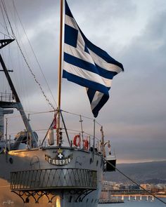 a large boat with a flag on top of it