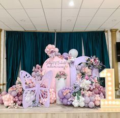 a table with balloons and decorations on it