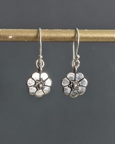 "Flower Silver Earrings, Tiny Oxidized Bali Sterling Silver Earrings, Delicate Flower Earrings, Charm Floral Boho Botanical Dangle. Total Length: 1 1/10\" ( 28 mm.) * Processing time is 3 - 5 days.  * US orders are shipped first class mail. * International orders are shipped first class international. * Shipping upgrades are available at checkout. Thank you for visiting my listing! Have a wonderful day!" Adjustable Dangle Earrings With Flower Charm, Metal Flower Charm Drop Earrings, Silver Flower Earrings With Lever Back Ear Wires, Metal Drop Earrings With Flower Charm, Adjustable Sterling Silver Dangle Flower Earrings, Dainty Dangle Flower Earrings Nickel Free, Silver Adjustable Flower Earrings, Dainty Dangle Flower Earrings, Dainty Dangle Flower Earrings With Ear Wire