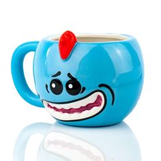 a blue coffee cup with a face painted on it's side and a red nose