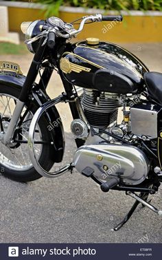 a black and gold motorcycle parked on the street