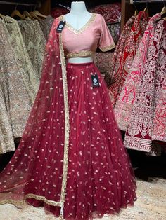 Crimson red sequence work lehenga with contrasting blush pink blouse and net dupatta. Fabric: Net This outfit can be customized in multiple colors and specific to client measurements. 90 days of production time is required and are for bulk orders only! Orders are processed in store only! Final fittings/alterations not included. Minimum Order Quantity- 4 pieces Designer Floor-length Net Sets, Pink Semi-stitched Net Lehenga, Pink Net Lehenga With Resham Embroidery, Red Party Wear Choli With Resham Embroidery, Red Resham Embroidered Party Wear Choli, Pink Resham Embroidery Anarkali Set, Fitted Net Lehenga For Diwali, Traditional Pink Net Lehenga, Pink Net Lehenga With Traditional Drape