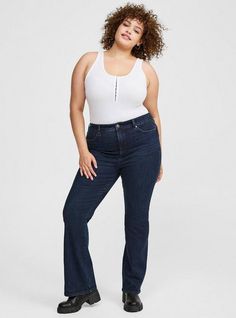 FIT Stretches up to three sizes so it always fits no matter what. High rise. . Slim fit from hip to thighs, then kicks out into the perfect boot cut. Inseams: Short 29”, Regular 31”, Tall 33”. MATERIALS + CARE Limitless Stretch Denim fabric: A superpowered fabric that stretches up to three sizes, holds its shape and fits every body type. . Stretch level: Hyper Stretch. 86% cotton, 11% polyester, 3% spandex. Imported. DETAILS 5-pocket design. WHY WE LOVE IT We all fluctuate sizes, why not have a jean that does too? This three-sizes-in-one style changes with your body, so you can feel good in it every time you slip it on. Say hello to the jean of the future. The best plus size women's short, petite trio boot high-rise jean bootcut jeans in nieve made of limitlessstretch. Torrid is your desti Most Comfortable Jeans, New Street Style, Stretch Denim Fabric, Style Change, Perfect Jeans, Bra And Panty Sets, Trendy Plus Size, High Rise Jeans, Denim Fabric