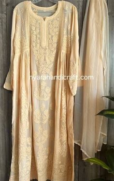 "Chikankari kurta on fine georgette with matching chiffon Dupatta. Matching liner included.  \"Embroidery designs may slightly vary\" Kurti Length-50 inches" Luxury Silver Dupatta With Chikankari Embroidery, Luxury Chikankari Embroidery Tunic For Festive Occasion, Luxury Jamawar Dupatta With Chikankari Embroidery, Luxury Chikankari Embroidered Dupatta For Spring, Luxury Summer Chikankari Embroidery Dupatta, Cream Georgette Kurta With Sheer Dupatta, Off White Georgette Kurta, Off White Georgette Anarkali Set With Chikankari Embroidery, Off White Georgette Kurta With Resham Embroidery