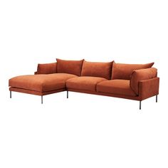 an orange sectional sofa with pillows on it's back and arms, in front of a white background