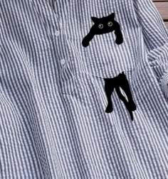 a black cat on a blue and white striped shirt