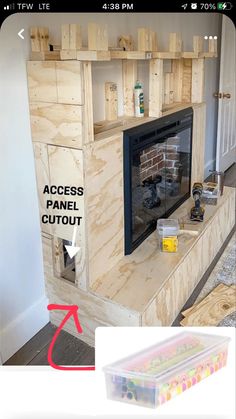 an unfinished fireplace is being built with wood pallets on the top and bottom part