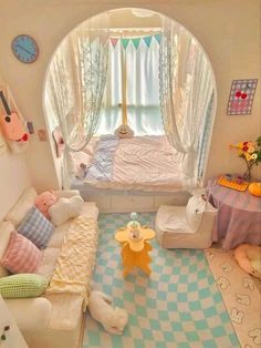 a child's bedroom is decorated in pastel colors and checkered rugs