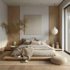 a large bed sitting on top of a wooden floor next to a tall white wall