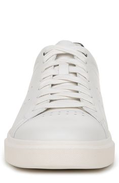 A low-top sneaker is textured with perforations and cushioned by a padded collar for all-day comfort. Leather upper/synthetic lining/rubber sole
 Imported White Sneakers With Perforated Toe Box, Classic Sneakers With Perforations And Plain Toe, Classic Plain Toe Sneakers With Perforations, Casual Sneakers With Perforations And Plain Toe, Casual Sneakers With Perforations, Classic Sneakers With Perforations In Synthetic Material, White Suede Plain Toe Sneakers, Classic Synthetic Sneakers With Perforations, Low-top Sneakers With Vented Sides And White Sole