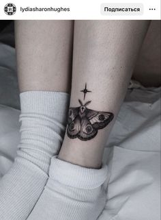 a woman's leg with a small butterfly tattoo on her left ankle and the star above it