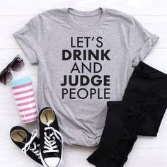 Lets Drink And Judge People Funny Short Sleeve Graphic Tee Shirt Super Soft And Comfy, These Are A Unisex Fit. I Make Each Shirt In-House. I Use Sublimation Printing To Make Each Shirt. Then I Press The Design Into The Fabric. This Shirt Will Not Peel, It's Not A Screen Print Or Vinyl. 100% Polyester Or A Polyester Blend Depending On What I Have In Stock. Wash Items Inside Out In Cold Water, Do Not Use More Bleach, Low Tumble Dry, And Steam Iron If Needed. Let Me Know If You Would Like To Purcha Fun Tee Shirts, Funny Womens Shirts, Trendy Heather Grey Tops With Letter Print, Trendy Heather Grey Top With Letter Print, Mom Shirts Vinyl Funny, Shirt Ideas Vinyl Women Funny, Funny Graphic T-shirt With Short Sleeves, Funny Tshirt Ideas, Funny T-shirts