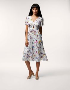 Get ready to dance and flutter into style with our Butterfly Dance Midi Dress! Featuring a whimsical butterfly print, this dress will add a touch of playfulness to your wardrobe. Perfect for any occasion, this dress is a must-have for any fashion lover. Midi dress 100% Cotton Hand wash cold, lay flat to dry Imported Whimsical Butterfly, Dress Butterfly, Betsey Johnson Clothes, Butterfly Print Dress, Fashion Masks, Midi Dress White, Dress Flats, Betsey Johnson Dresses, Print Dresses