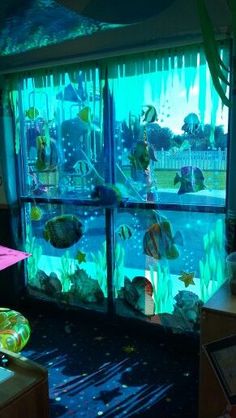 an aquarium in the corner of a room