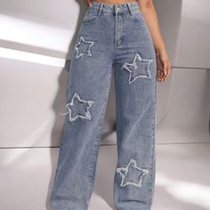 Vintage Blue Distressed Jeans with star patch detailing, perfect for adding an edgy twist to your everyday style. The distressed patches, shaped like stars, give the jeans a unique look, while the high-waisted design and wide-leg fit offer both comfort and fashion.  Handmade from durable denim, they are great for casual outings, running errands, or weekend get-togethers. The light blue color makes these jeans versatile, perfect for pairing with a variety of tops and shoes for a laid-back, yet fa