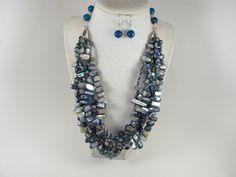 "Chunky navy blue shell and agate statement necklace, silver peacock blue statement necklace, beaded necklace, royal blue shell statement jewelry A bold and dramatic statement necklace featuring natural blue mother of pearl beads and round agate beads. 5 strands, light weight. Silver plated lobster clasp. Measurements: 21\" (47 cm) plus 3 1/2\" extender. Each piece of jewelry from my shop comes beautifully packaged in box and ready for gift giving.  Thank you for shopping at my shop! 46" Blue Large Beads Dangle Necklace, Luxury Large Beaded Blue Necklace, Luxury Blue Baroque Pearl Necklace, Luxury Blue Statement Necklace, Blue Beaded Shell-shaped Necklace, Blue Statement Necklace, Blue Shell, Silver Necklace Statement, Necklace Beaded