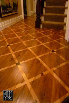 a wooden floor in a house with stairs