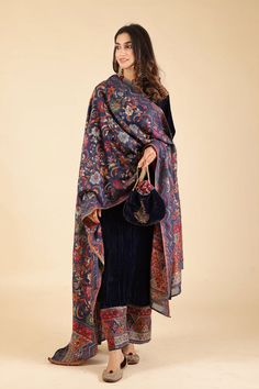 PRODUCT DESCRIPTION: This elegant shawl is an ideal choice for women. Its classic design features intricate all-over weave and a deep, sophisticated color. Perfect for weddings, Diwali parties, or any special occasion, it's a must-have for a refined wardrobe. SPECIFICATIONS: Color Blue Fabric Chanderi Product Code MS19 Woven Shawls