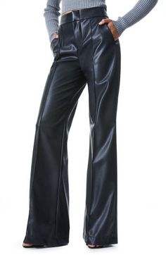 Step out like a '70s icon in these totally boss faux-leather pants, fashioned with a sky-high waist, wide-swept legs and all the swagger of the real deal. Zip fly with hook-and-bar closure Side-seam pockets Lined 100% polyester with 100% polyurethane face Dry clean Imported Women's Clothing Leather Wide Leg Pants, High Waist Wide Leg Pants, Alice And Olivia, Faux Leather Pants, Alice Olivia, Black Faux Leather, Wide Leg Trousers, Fashion Pants, Leg Pants