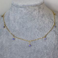 Blue Sapphire Necklace Cornflower Blue Natural Sapphire Necklace Gift for her solid 14K Yellow Gold 38- 42cm length. Introducing our captivating dainty yellow gold station necklace, adorned with seven mesmerizing pieces of vivid blue sapphire. Each gemstone embodies a fiery intensity, carefully chosen and expertly set to create a striking contrast against the warm glow of the gold. This necklace is designed to add a bold pop of color and sophistication to any attire, making it a versatile choice Sapphire Necklace With Adjustable Chain, Blue 14k Gold Necklace With Adjustable Chain, 14k Gold Necklace With Blue Adjustable Chain, Fine Jewelry With Blue Delicate Chain, Sapphire Tanzanite Birthstone Necklaces, Blue Fine Jewelry With Delicate Chain, Blue Fine Jewelry With Adjustable Chain, Elegant Blue Charm Necklace With Adjustable Chain, Blue Pendant Jewelry With Delicate Chain