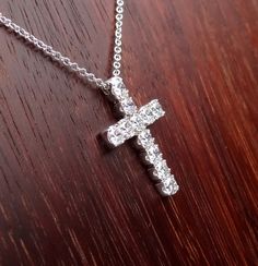 "This 18k white gold pendant is a high quality cross. This cross pendant is 23mm height by 15mm width made in 18k white gold approximately 5.5 grams total weight. It has 11 quality diamonds VS2 - SI1 clarity and G-H color range 1.10 cts total weight. The Italian 18k white gold chain can be 16,17 or 18 inch long . We love these pendant because it represents the way jewelry should be made with craftsmanship and quality. This pendent is anything but ordinary. Our pieces are designed and made with c Hallmarked Platinum Diamond Necklace As Gift, Luxury Diamond Cross Pendant Necklace For Formal Occasions, Sterling Silver Cross Diamond Necklace For Formal Events, Sterling Silver Cross Diamond Necklace For Formal Occasions, Formal Cross-shaped Sterling Silver Diamond Necklace, Formal Vvs Clarity Diamond Cross Pendant Necklace, Formal Diamond Cut Cross Necklace, Platinum Diamond Necklace With Polished Finish As Gift, Timeless Jewelry Gift