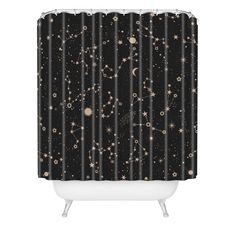 a shower curtain with stars and planets in the night sky on black, it is shown