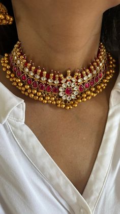 Discover the epitome of elegance with our premium choker necklace set. Crafted with precision and designed to turn heads, this set is a true masterpiece. Product Details: Material: Each piece is meticulously handcrafted from high-quality brass, Copper, Silver, Kundan, 22 Karat Gold Plating, Soft Fabric lining inside. Choker Necklace Dimensions: Weight: 100 grams. Closure Type: Premium Dori Adjustable Size: Yes  Earring Dimensions (Per Pair): Weight: 32 grams Length: 6.5 cm Width: 5 cm Closure Ty Luxury Silver Bridal Necklace For Ceremonial Occasions, Elegant Red Bridal Necklace For Ceremonial Occasions, Exquisite Ceremonial Jewelry Hand Set, Elegant Ruby Bridal Necklace For Festive Occasion, Elegant Ruby Bridal Necklace For Festive Season, Traditional Wedding Choker Jewelry, Elegant Kundan Necklace With Ruby And Intricate Design, Elegant Ruby Kundan Necklace With Intricate Design, Ceremonial Fine Jewelry With Hand Set Details