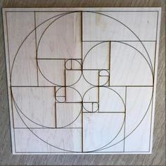 a piece of wood that has been cut into squares and circles with the same design on it