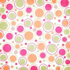 an orange, pink and green polka dot pattern on white fabric with circles in the center