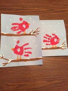 two handprinted cards with red birds on them