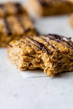 chocolate drizzled oatmeal bars on top of white countertop