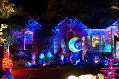 a house covered in christmas lights and decorations