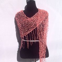 "This shimmery shawl might not keep you warm, but it is definitely a hot accessory!  Very lightweight, it is appropriate for any season. It is knitted completely by hand in an unusual \"yarn\" that looks like beads from a distance. It can be worn as either a shawl, a scarf, a belt, or a sarong. Be prepared for comments and compliments--this scarf is an eye-catcher  And with FREE fast shipping, you will have this scarf in just a few days. *Completed and ready to ship FREE. *Made entirely by hand One Size Knitted Shawl In Acrylic Yarn, One Size Knitted Yarn Shawl, One Size Knitted Shawl Made Of Yarn, Knitted Yarn Shawl, Hand Knitted One Size Shawl Wrap, One Size Knit Shawl Scarves, Hand Knitted Acrylic Shawl One Size, Crochet Wrap, One Size For Winter, One Size Knit Shawl Scarf