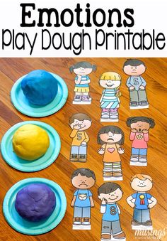 the play dough printable for emotions is shown on a wooden table with blue plates