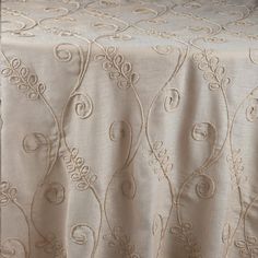 a white table cloth with decorative designs on it