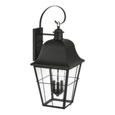 an outdoor wall light with four lights on the front and back side, in black