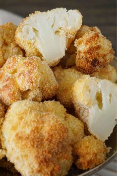 a bowl filled with fried food on top of a table