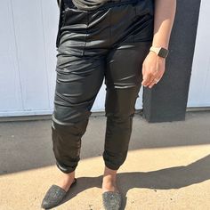 Black metallic joggers with a jogger fit. Featuring an elastic waistband for the perfect fit. Easy to dress up or down. 13% Spandex, 87% Polyester Faux Leather Joggers, Leather Joggers, Ruffle Tank Top, Flower Bag, Pink Ruffle, Bag Dress, Black Metallic, Black Faux Leather, Turquoise Stone