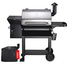 a black bbq grill with the lid open next to it's side bag