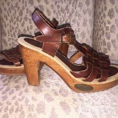 Vtg 1970’s Fanfares. New Never Worn, Handmade Brazilian Leather And Hand Carved Wood Heels. (Imperfections Are Its Character) New Clean Vintage Condition. Deep Oxblood, Burgundy, Rust Woven Huarache Top With A Brass Buckle Strap Around Ankle. Sole Is A Burlap Linens Fabric With No Wear Marks Either On The Sole Or Bottom Of Shoe. (There Are Some Scratches In The Wood From Being Stored In A Box Of Shoes But Could Be Buffed Out With Polish.) Rubber Grooved Sole, 4.25 Wooden Heel With Brass "Fanfares" Emblem Nailed Into Front Side Of Shoe. Labeled "Fanfares Made In Brazil 789 Ee 59 7m As403" Size 7 Vintage Ankle Strap Heels Medium Width, Vintage Heels With Heel Strap, Vintage Leather Sandals With Round Toe, Vintage Leather Sandals For Spring, Vintage Round Toe Heels For Spring, Vintage Spring Heels With Round Toe, Spring Vintage Round Toe Heels, Retro Closed Toe Heels With Stacked Heel, Vintage Brown Ankle Strap Heels